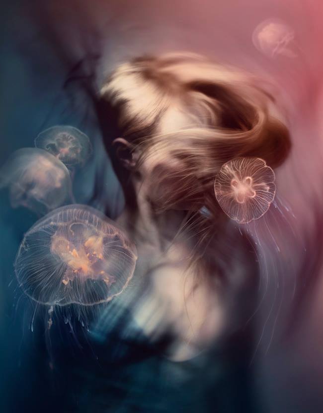 Person with flowing hair surrounded by jellyfish in a dreamy underwater scene