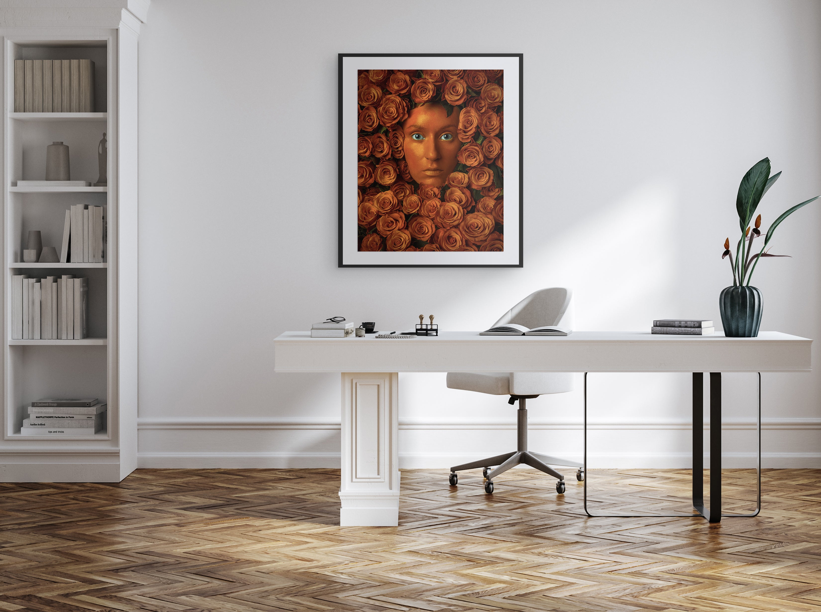 Modern office setup with a desk, chair, and wall art in a well-lit room.